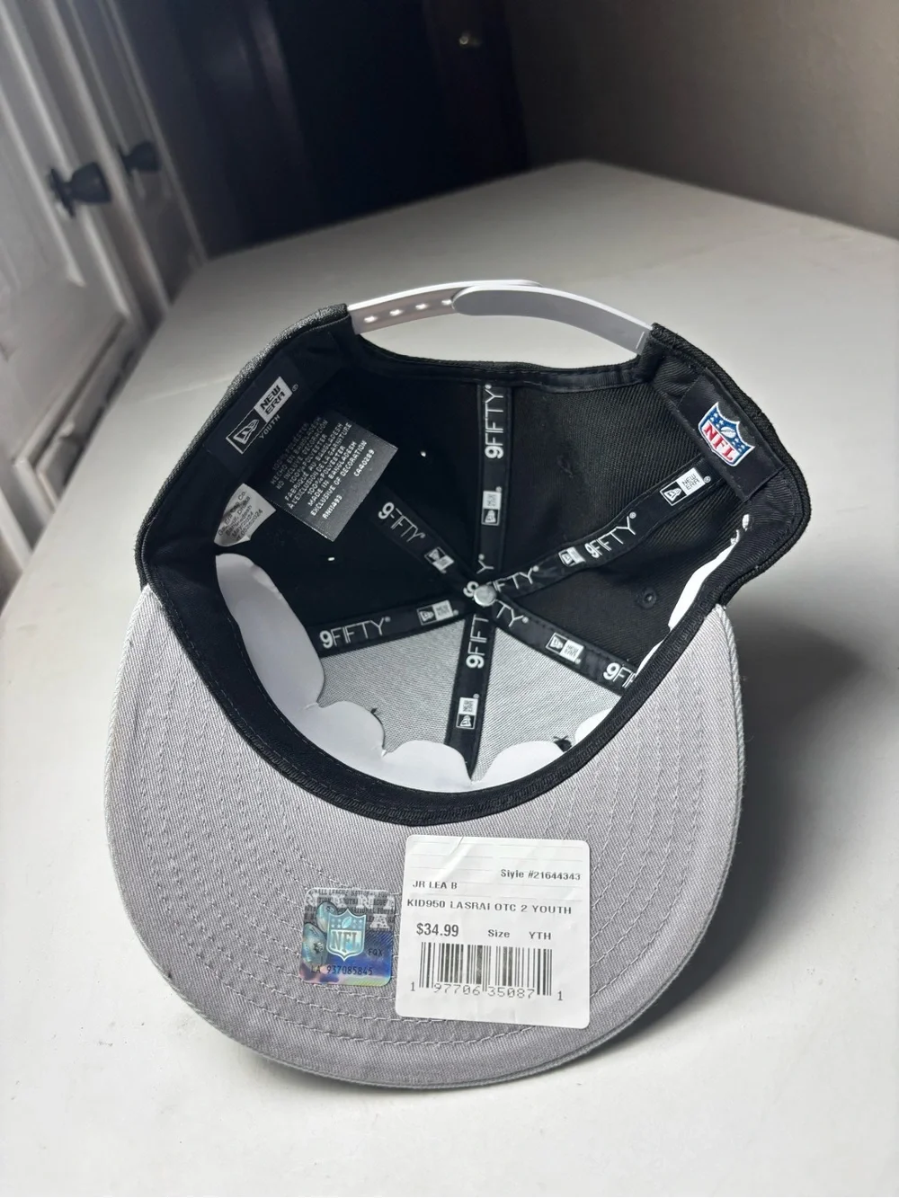 Youth New Era Las Vegas Raiders snapback cap in black & gray with white Raiders
